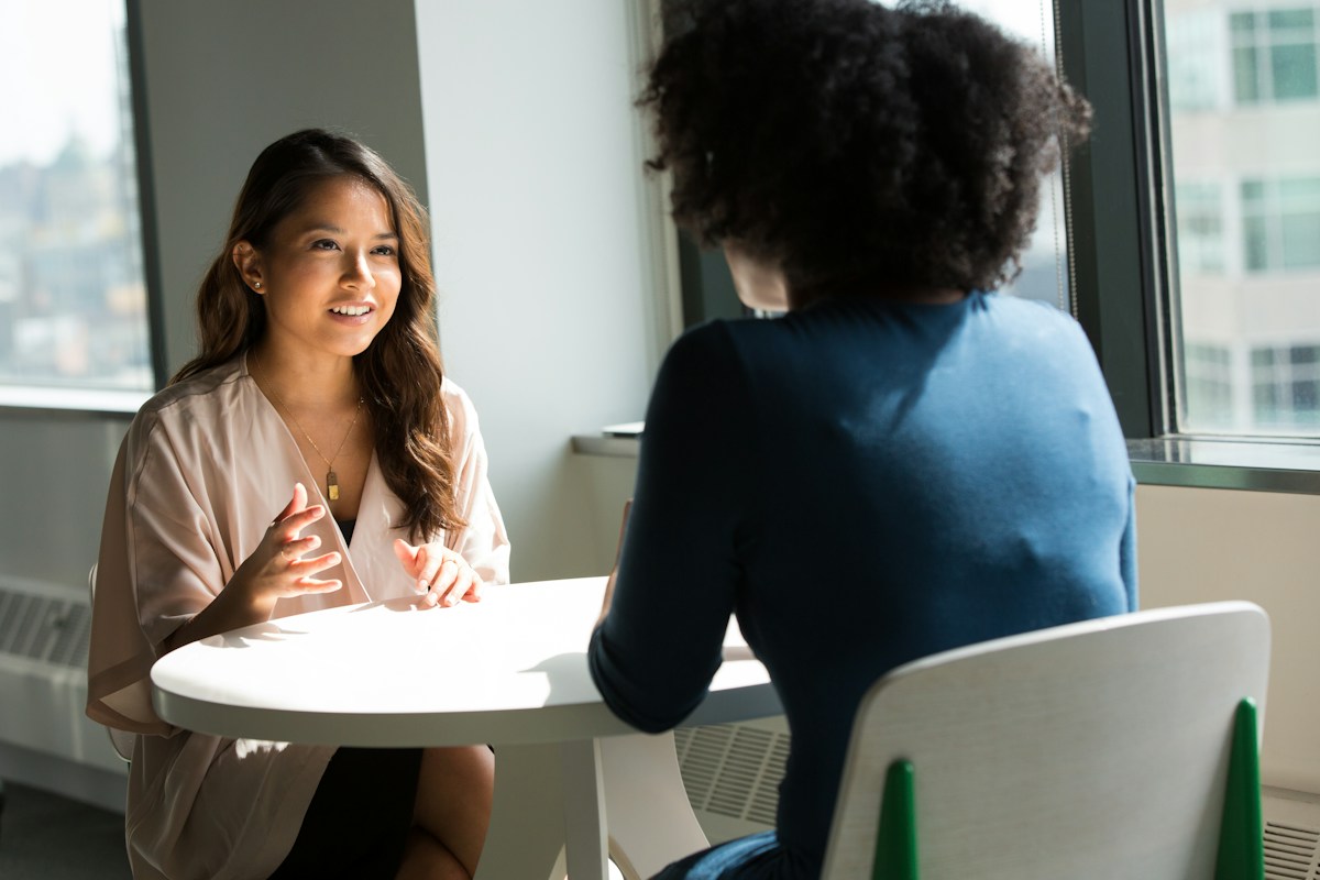 Two people having a focused, face-to-face conversation